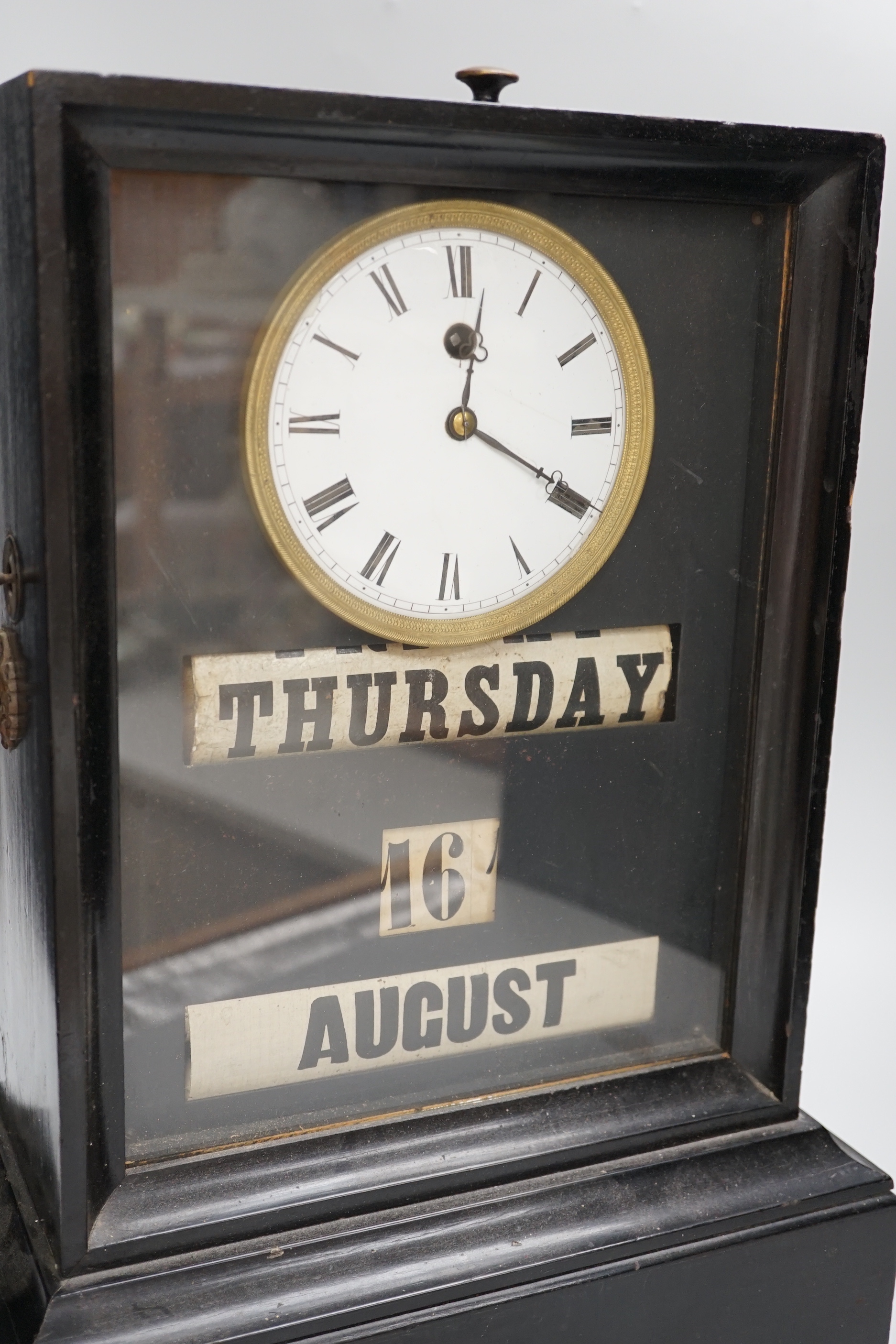 A 19th century ebonised mantel clock combined perpetual calendar, 44cm tall